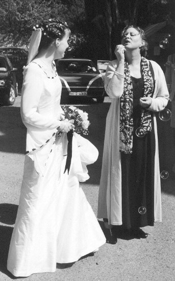 Mother of the bride getting some practice with the bubbles... Click here to return to this photo's thumbnail in the Wedding Photo Index